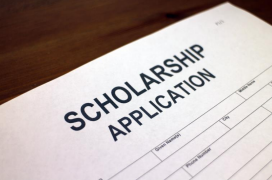 A closeup of a scholarship application form with bold text at the top and spaces below for the applicant to fill out their information.