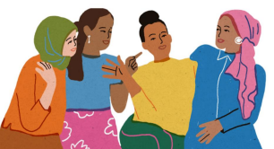 Four women wearing colorful clothing and headscarves sit together, smiling and engaging in conversation, suggesting friendship and connection.