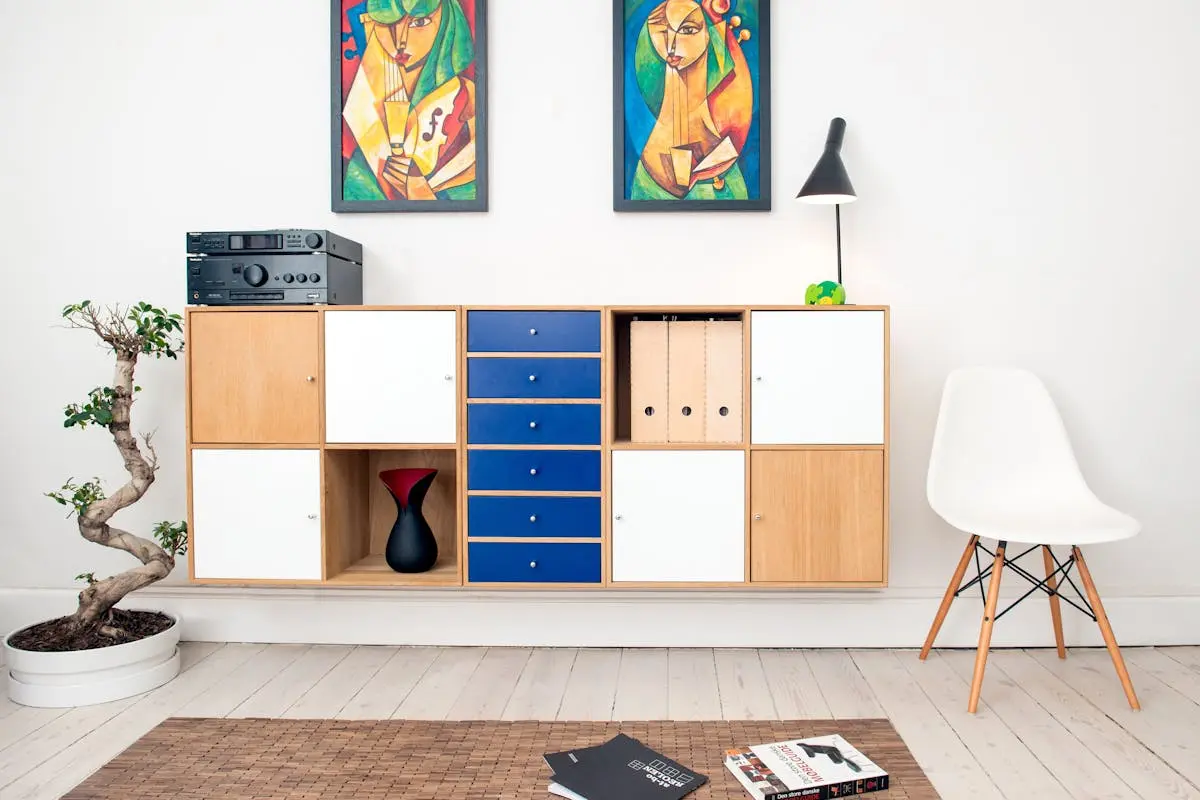 Contemporary room design featuring colorful artwork, sleek furniture, and decorative elements.