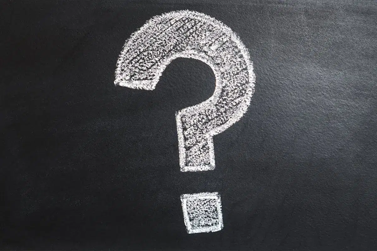 A conceptual image featuring a question mark drawn on a chalkboard, ideal for problem-solving contexts.