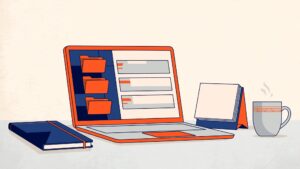 Laptop with colorful email folders beside a notebook, coffee mug, and blank calendar.